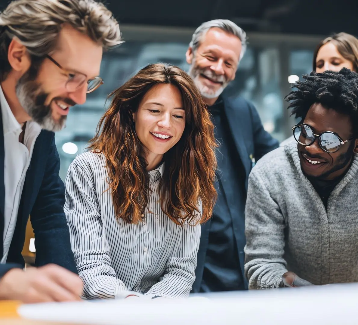 a coach facilitating a discussion around a table