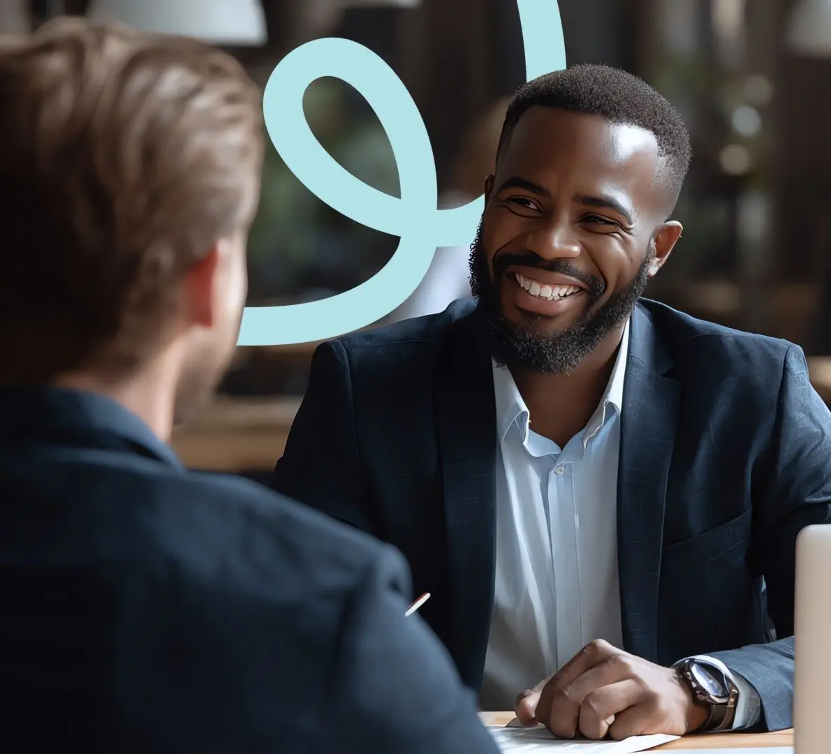 a professional coach and client talking across a small table