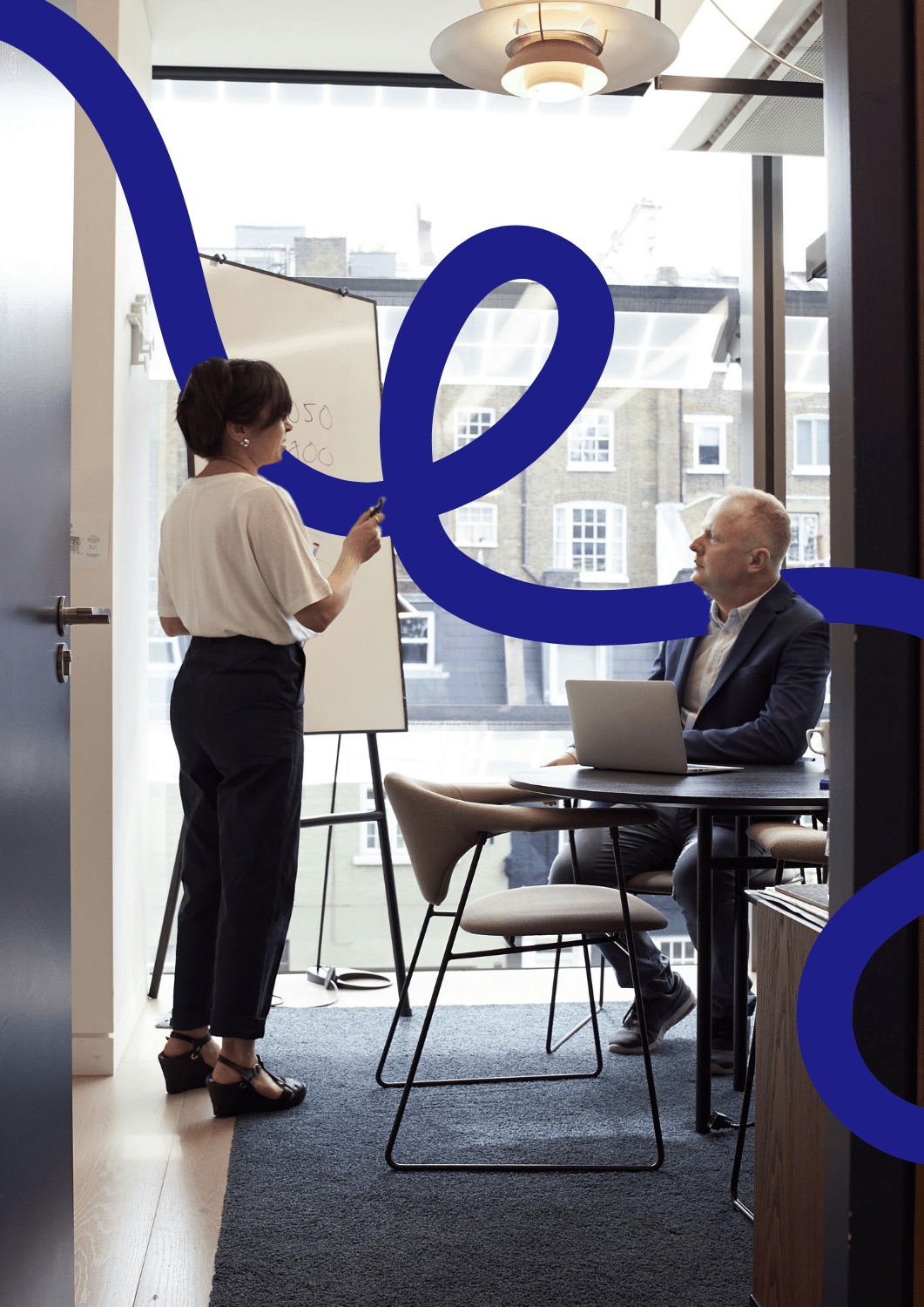 A frustrated manager sitting alone with paperwork, overwhelmed and confused by unclear or ineffective training outcomes.