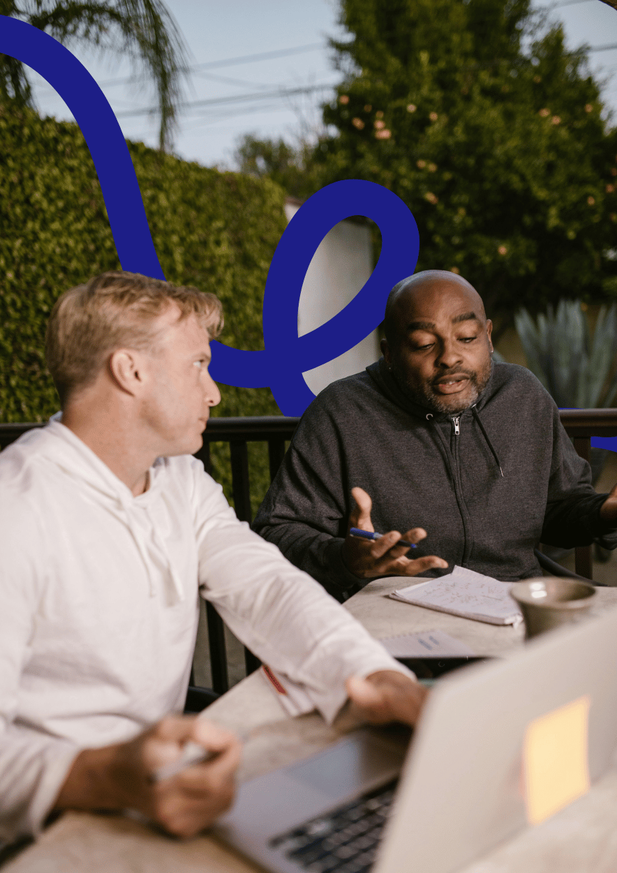 A frustrated manager sitting alone with paperwork, overwhelmed and confused by unclear or ineffective training outcomes.